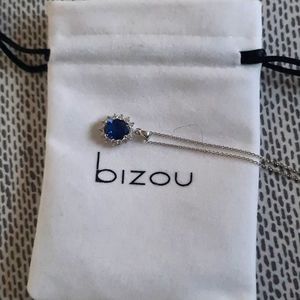 Bizou necklace with an blue stone surrounded by diamond stars